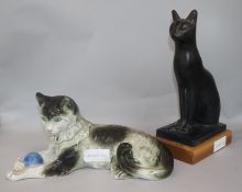 A Sitzendorf cat, 31cm. and an Egyptian style resin cat