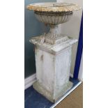 A pair of Victorian cast iron composition urns W.55cm