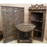 Two carved oak corner cupboards and occasional table W.70cm,55cm,53cm