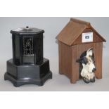 A bakelite musical cigarette dispenser and a similar pottery 'kennel' 21cm.