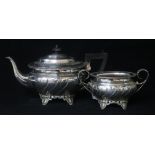 A George V embossed silver teapot and sugar bowl, by Henry Matthews, Birmingham, 1916, gross 28.5
