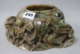 A Chinese green jade brushwasher W.20cm