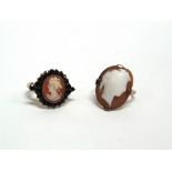 A GARNET SET SHELL CAMEO RING and a shell cameo ring, stamped '9ct', 3.4g gross