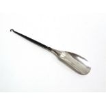 A SILVER AND IRON SHOE LIFT/BUTTON HOOK by Samuel Jacob, London 1913, overall 27cm long