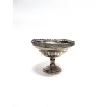 A SILVER PEDESTAL FRUIT BOWL by Deakin & Francis, Birmingam 1930, the panelled bowl with pierced