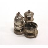 AN EDWARDIAN SILVER CRUET SET ON STAND by the Goldsmiths and Silversmiths Co Ltd, London 1904, the