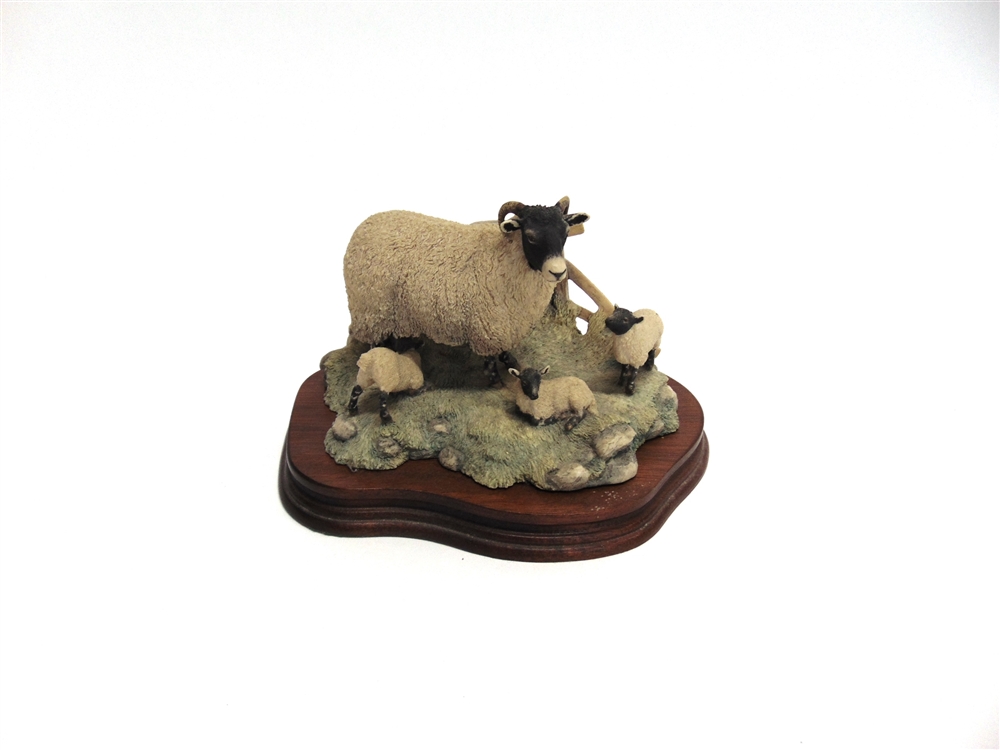 A BORDER FINE ARTS GROUP from the James Herriot series modelled as a ewe with three lambs, on shaped