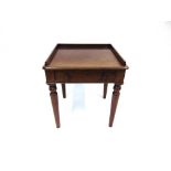 A VICTORIAN MAHOGANY OCCASIONAL TABLE with three quarter gallery and drawer under and raised on four