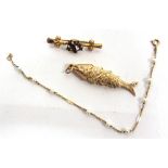 A 9 CARAT GOLD FLEXI FISH CHARM with an Edwardian brooch stamped '9ct'; and a bracelet with cultured