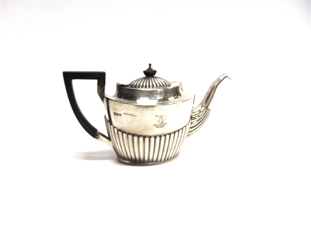 A LATE VICTORIAN SILVER BACHELOR TEAPOT makers mark rubbed, Chester 1900, of oval gadrooned form,