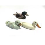 THREE WOODEN PAINTED FIGURES OF DUCKS the largest 35cm long (3)