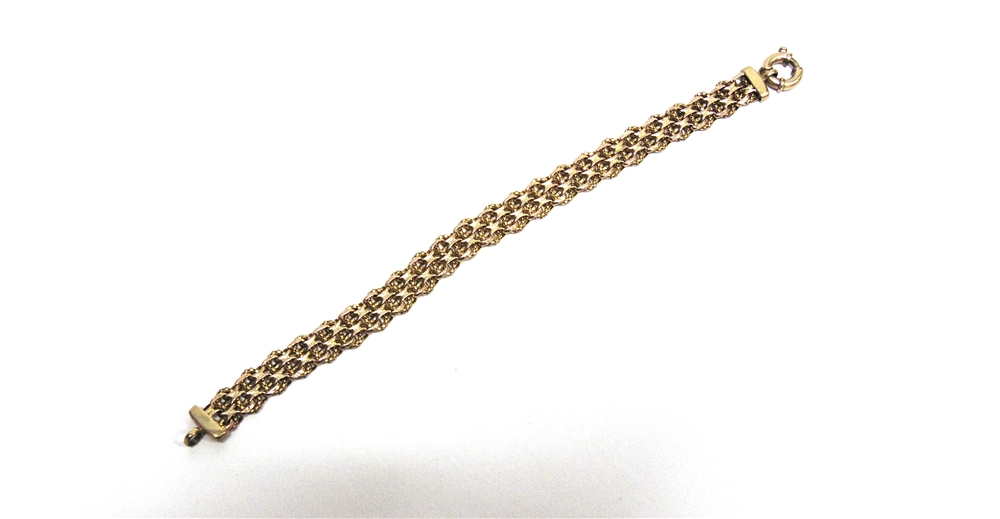 A 9 CARAT GOLD BRACELET of wide fancy links, 20cm long, 10g gross