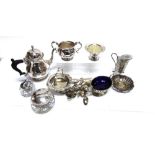 A PLATED THREE PIECE TEA SERVICE with a plated cream jug with glass liner, tea strainer and other