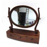 AN EDWARDIAN MAHOGANY DRESSING TABLE MIRROR the bow front base fitted with three drawers, 55cm