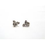 A PAIR OF THREE STONE DIAMOND EARSTUDS of trefoil design, the six modern brilliant cuts totalling
