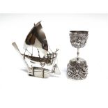 A MODEL OF A SAILING VESSEL WITH STAND stamped 'Silver', '925' and a script mark, 12.5cm long,