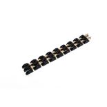 AN ART DECO BLACK AND GILT COSTUME JEWELLERY BRACELET 18.5cm long