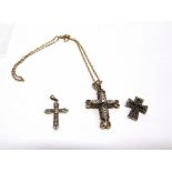 A 9 CARAT GOLD CUBIC ZIRCONIA SET CROSS PENDANT on a chain stamped '750', 5.7g and 5g gross