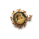 AN EDWARDIAN PICTURE PENDANT stamped '15ct', glazed to the front and back with a seed pearl set