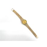 OMEGA, QUARTZ, A LADY'S 9 CARAT GOLD BRACELET WATCH the gilt TV shaped dial with black batons and