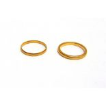A 22 CARAT GOLD WEDDING RING and another similar, 5g gross