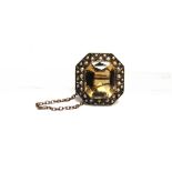 A VICTORIAN CITRINE AND SPLIT PEARL BROOCH stamped '9ct', the rectangular cut stone enclosed by a