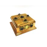 A VICTORIAN BRASS BANDED AGATE SET GOTHIC JEWELS CASKET with cabochons set to the decoration, 20cm