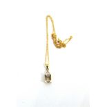 A 9 CARAT GOLD PALE AQUAMARINE AND DIAMOND PENDANT on a chain, pendant 2.1cm long including bale,