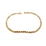 A 9 CARAT GOLD COLLAR of shaped batons and kiss links, to a box clasp with a safety catch, 41.5cm