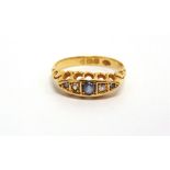 A SAPPHIRE AND DIAMOND FIVE STONE 18 CARAT GOLD RING Chester hallmark, finger size M1/2, 2.5g gross,