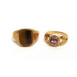 A 9 CARAT GOLD TIGER EYE SIGNET RING finger size S1/2; with a 9 carat gold amethyst dress ring,