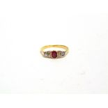 A RUBY AND DIAMOND RING unmarked, the oval cut ruby, approximately 4.5mm by 3.99mm by 3.6mm deep,