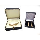 A 9 CARAT THREE COLOUR GOLD BRACELET with matching drop earrings, 11g gross, both cased.