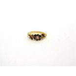 A VICTORIAN DIAMOND AND BLACK ENAMEL (MOURNING RING) the central old brilliant cut of