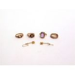A 9 CARAT AMETHYST RING a 9 carat gold garnet and opal ring; a 9 carat gold knot ring; 8.3g gross;