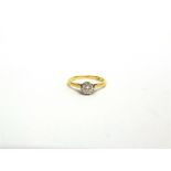 A SINGLE STONE DIAMOND RING stamped '18ct' and 'Plat', the mirror set brilliant cut approximately