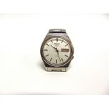 SEIKO, A GENTLEMAN'S STAINLESS STEEL AUTOMATIC WRISTWATCH with day date work, on a Seiko bracelet,