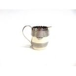 A GEORGE III SILVER CREAM JUG by George Smith II, London 1790, of oval outline with reeded bands and