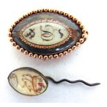 A GEORGIAN MOURNING BROOCH circa 1780, of navette shape, the glazed panel with painted monogram