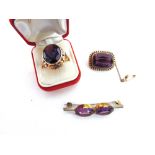 A VICTORIAN AMETHYST AND SEED PEARL BROOCH stamped '15ct', 2.7cm long, 8g gross; a ring set with a