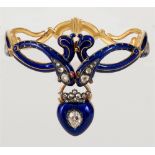 AN UNUSUAL VICTORIAN DOUBLE SERPENT DIAMOND, RUBY AND BLUE ENAMEL GOLD HINGED BANGLE the confronting