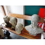 A GROUP OF RECONSTITUTED STONE HEADS all probably mid 20th century, the largest 53cm high