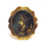 A LATE 19TH CENTURY INDIAN PORTRAIT MINIATURE BROOCH by repute the image of Sha Jihan, in a gilt