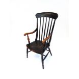 A COMB BACK WINDSOR ARMCHAIR on H-shape stretcher base, the elm seat 48cm wide 44cm deep, 109cm high