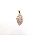 A 9 CARAT GOLD DIAMOND CLUSTER PENDANT of marquise shape, the thirty seven diamonds totalling