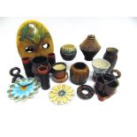PHILLIP JOHN BENNETT: a collection of Studio Pottery vases, two clocks, and a wall mask 33cm high