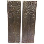 A PAIR OF ART NOUVEAU EMBOSSED METAL FINGER-PLATES each 25.5cm long.