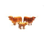 A BESWICK FAMILY GROUP OF HIGHLAND CATTLE comprising bull 12.5cm high, cow 13cm high (both stamped