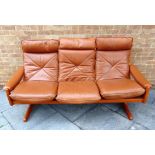 LIED MOBLER, NORWAY: a 1980s three seater leather upholstered sofa on teak frame, 194cm wide 81cm