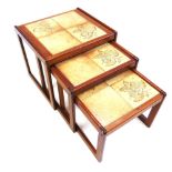 A NEST OF THREE TEAK TILE TOP TABLES the largest 54cm wide 47cm deep 47cm high